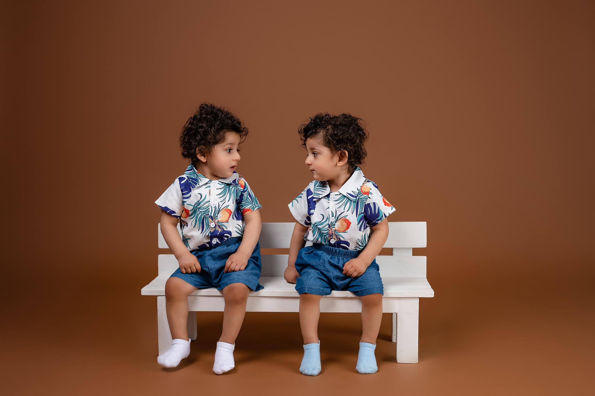 Family portrait two children parents studio photoshoot