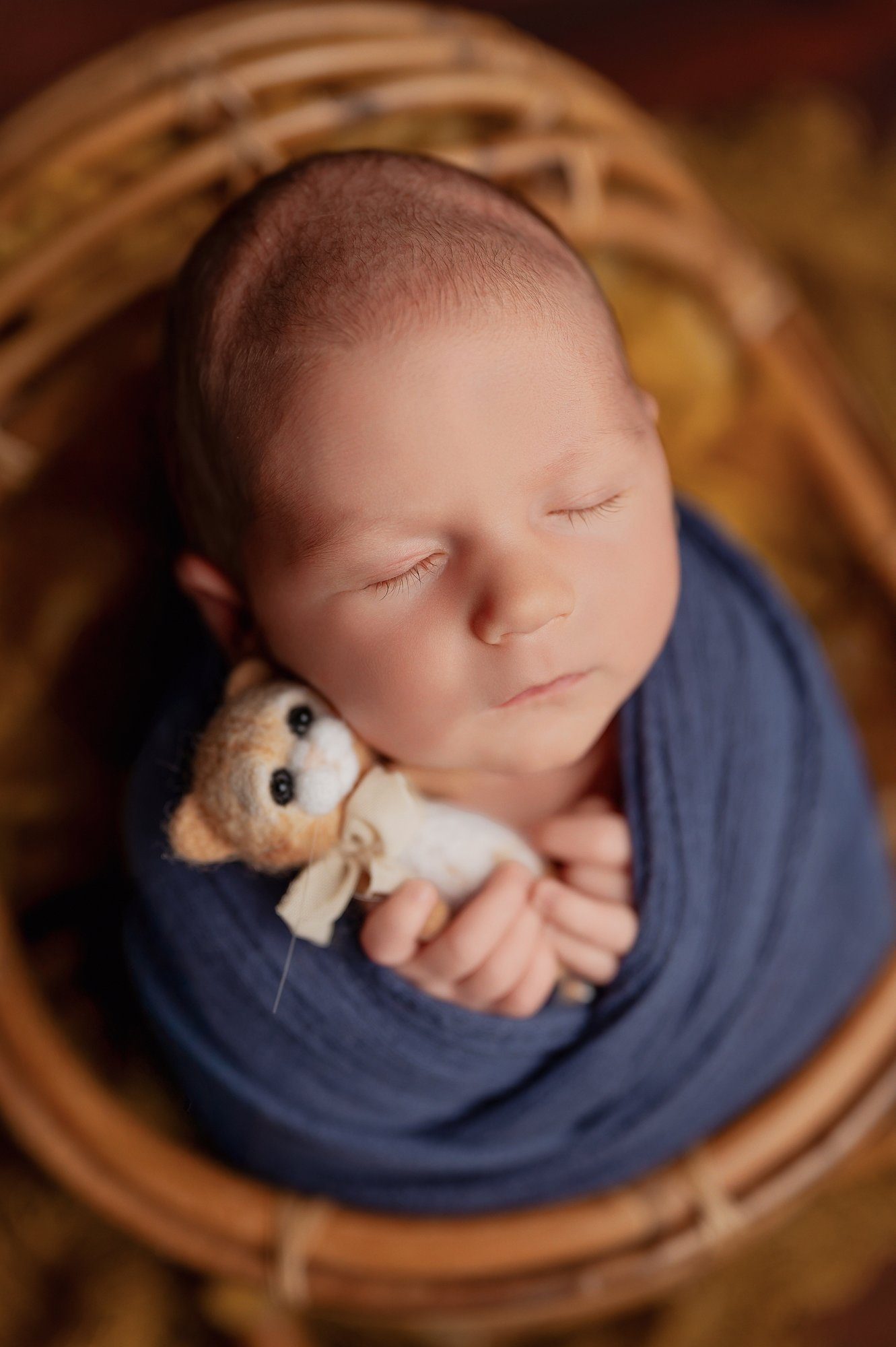 Close up of newborn baby sleeping peacefully during professional photography session