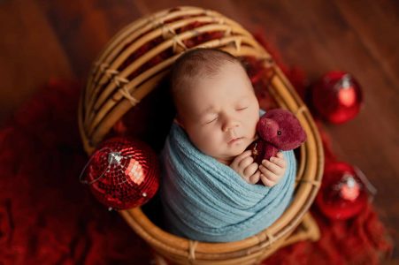 Adorable newborn baby yawning during session