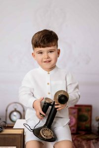 Cute child smiling at camera during session