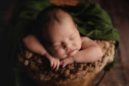 Peaceful sleeping newborn baby boy portrait