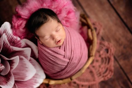 newborn baby girld witg pink wrap and theme