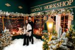 Santa's Workshop Christmas set with a lit lantern and a decorated shopfront